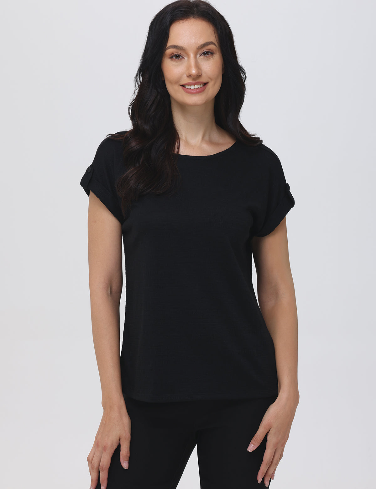 Woman wearing a black t-shirt against a white background