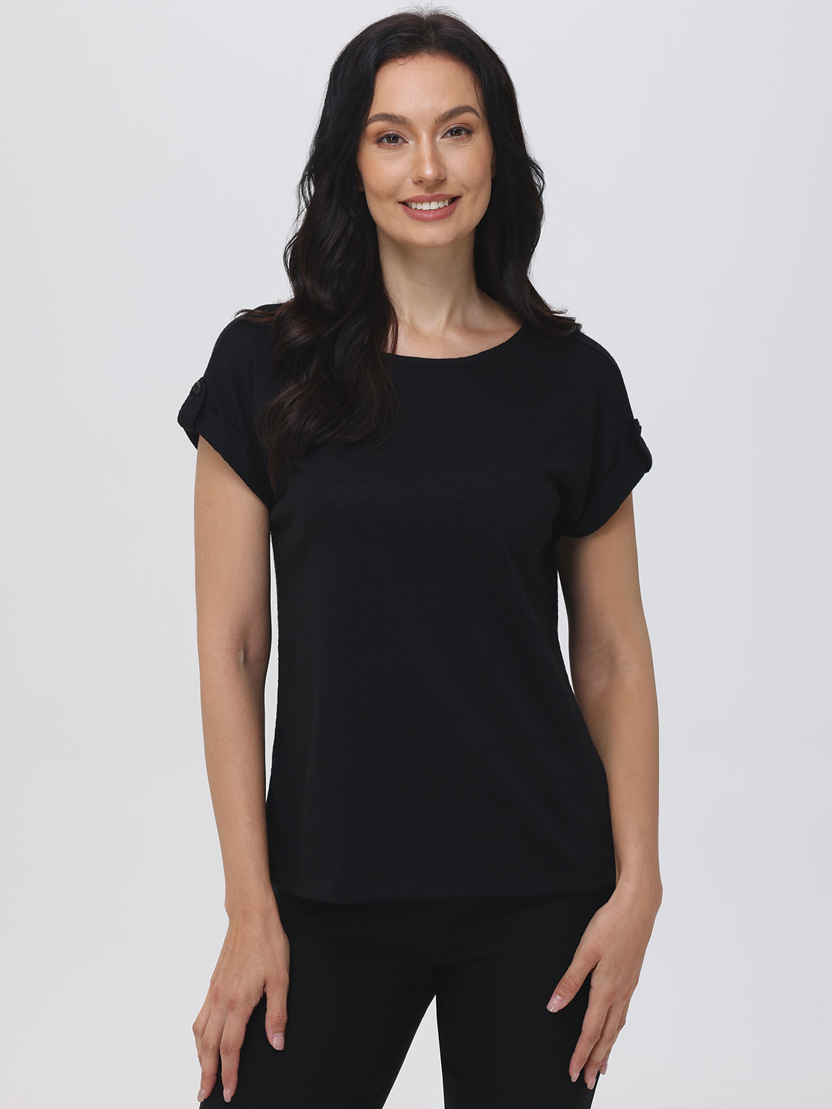 Woman wearing a black t-shirt against a white background