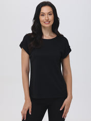 Woman wearing a black t-shirt against a white background