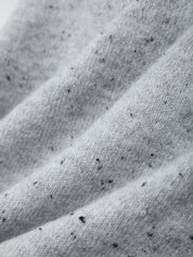 Close-up of textured gray fabric with a subtle pattern