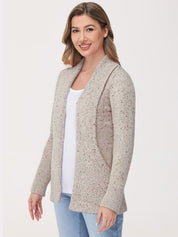 Woman wearing a beige knitted cardigan on a white background