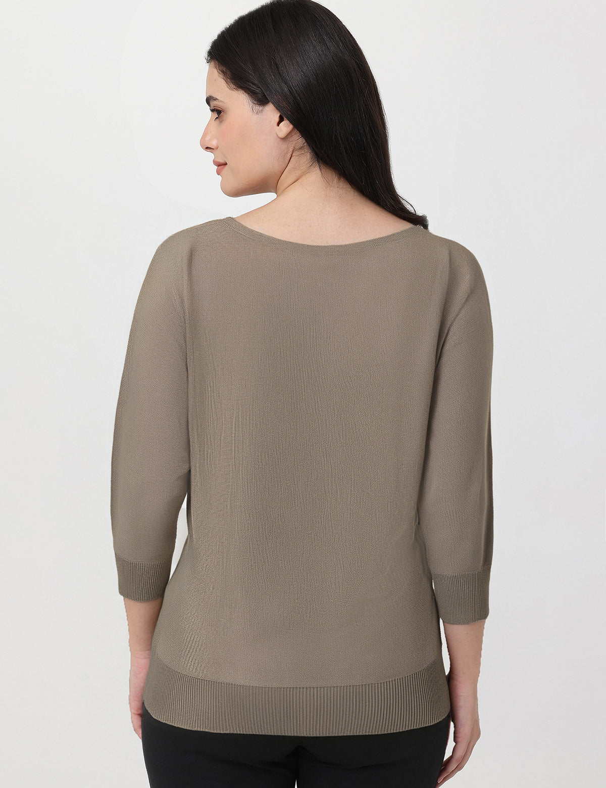 Woman wearing a brown sweater on a white background