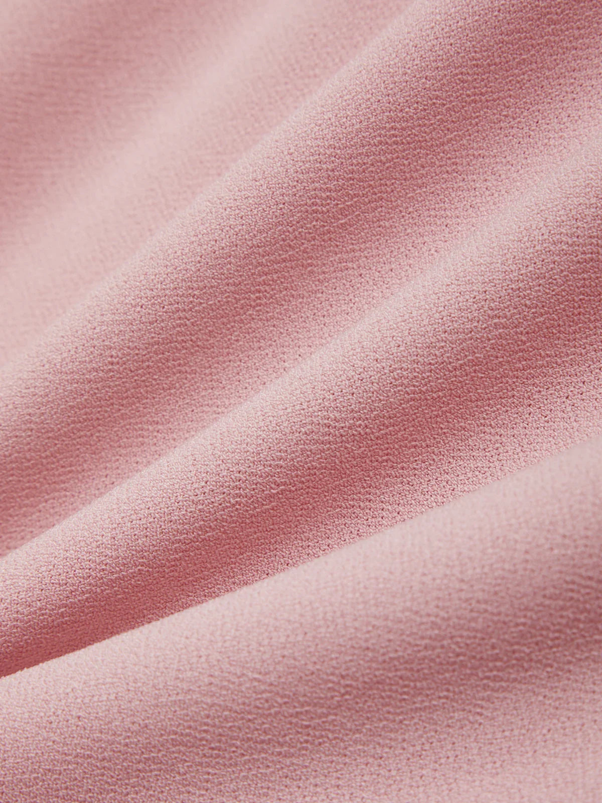 Close-up of pink fabric with a soft texture