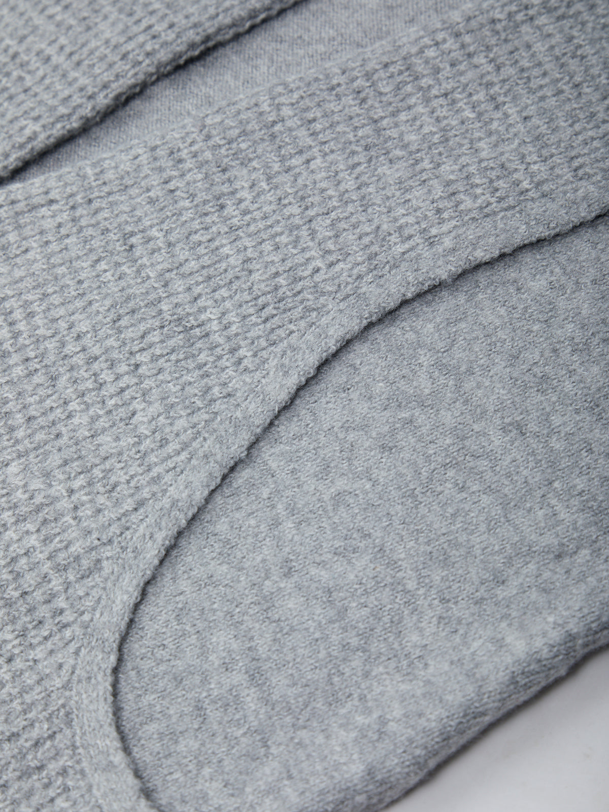 Close-up of a textured gray fabric surface