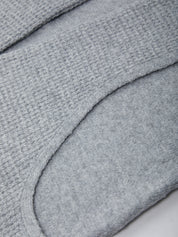 Close-up of a textured gray fabric surface
