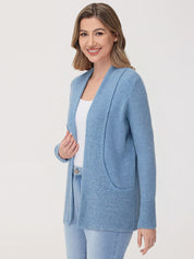 Woman wearing a blue cardigan on a white background