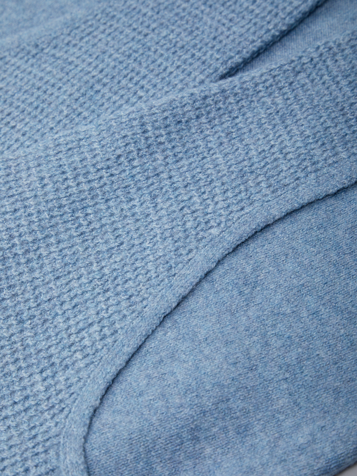 Close-up of a textured blue fabric surface