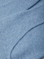 Close-up of a textured blue fabric surface