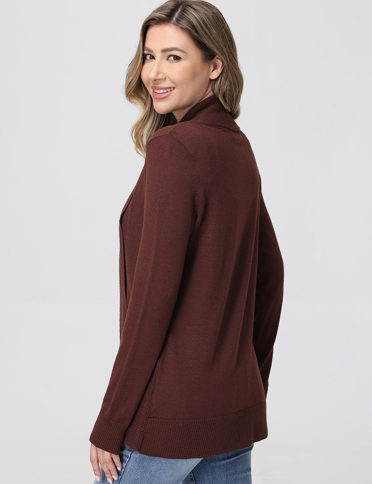Woman wearing a brown cardigan on a white background