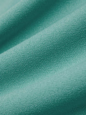 Close-up of teal fabric with a soft texture