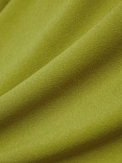 Close-up of green fabric with visible texture