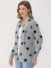 Woman wearing a gray cardigan with black star patterns on a white background