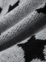 Close-up of a knitted fabric with black and white pattern