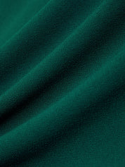Close-up of dark green fabric with visible texture