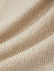 Close-up of beige fabric with a soft texture
