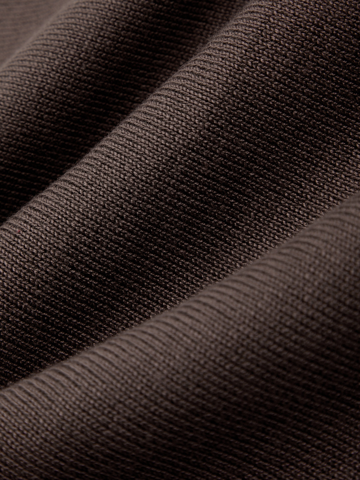 Close-up of dark brown fabric texture