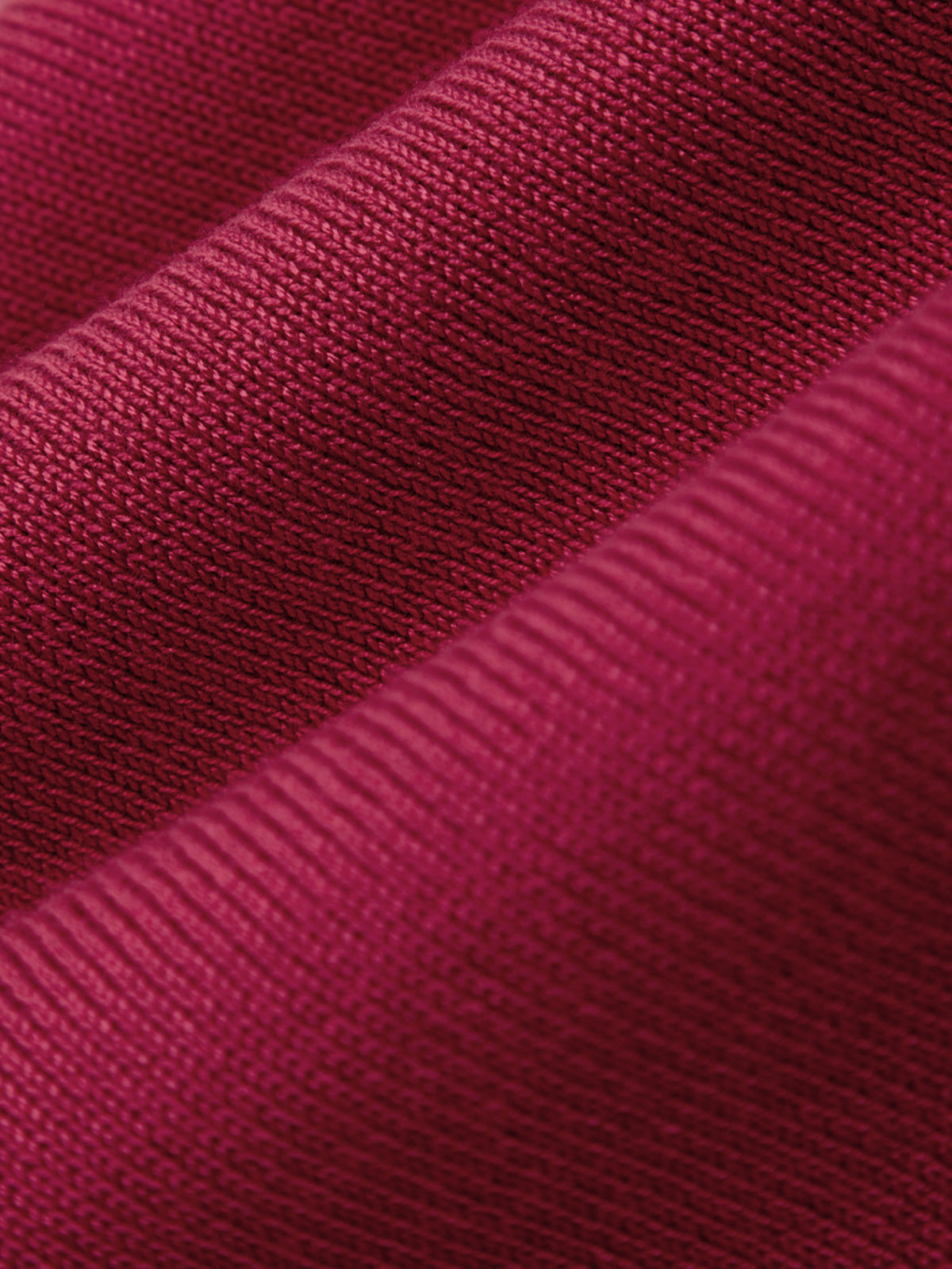 Close-up of a textured red fabric surface