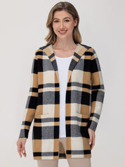 Woman wearing a checkered cardigan on a white background