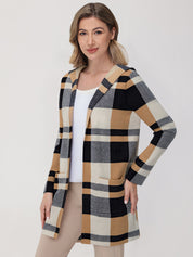 Woman wearing a plaid cardigan on a white background