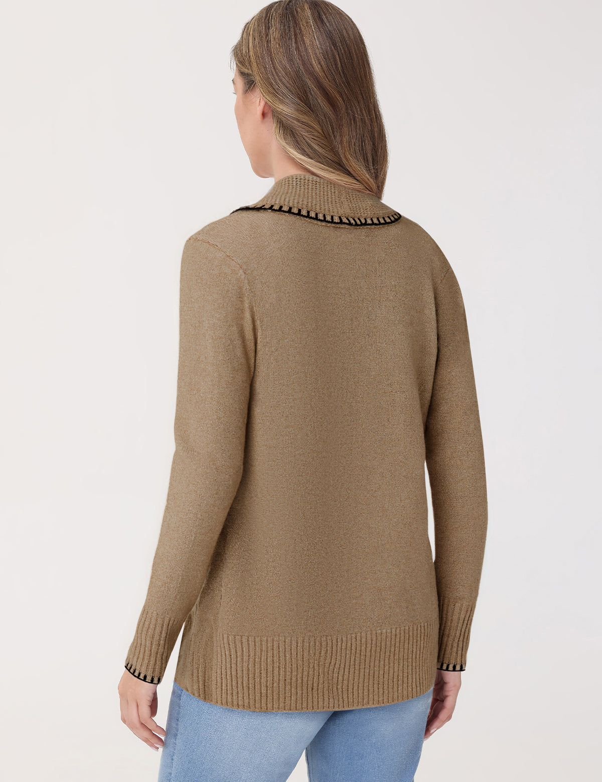 Woman wearing a beige sweater with decorative trim on a white background