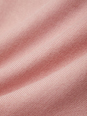 Close-up of pink fabric with a ribbed texture