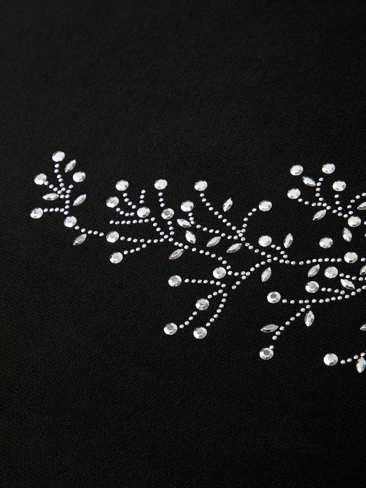 Rhinestone embroidery on a black background