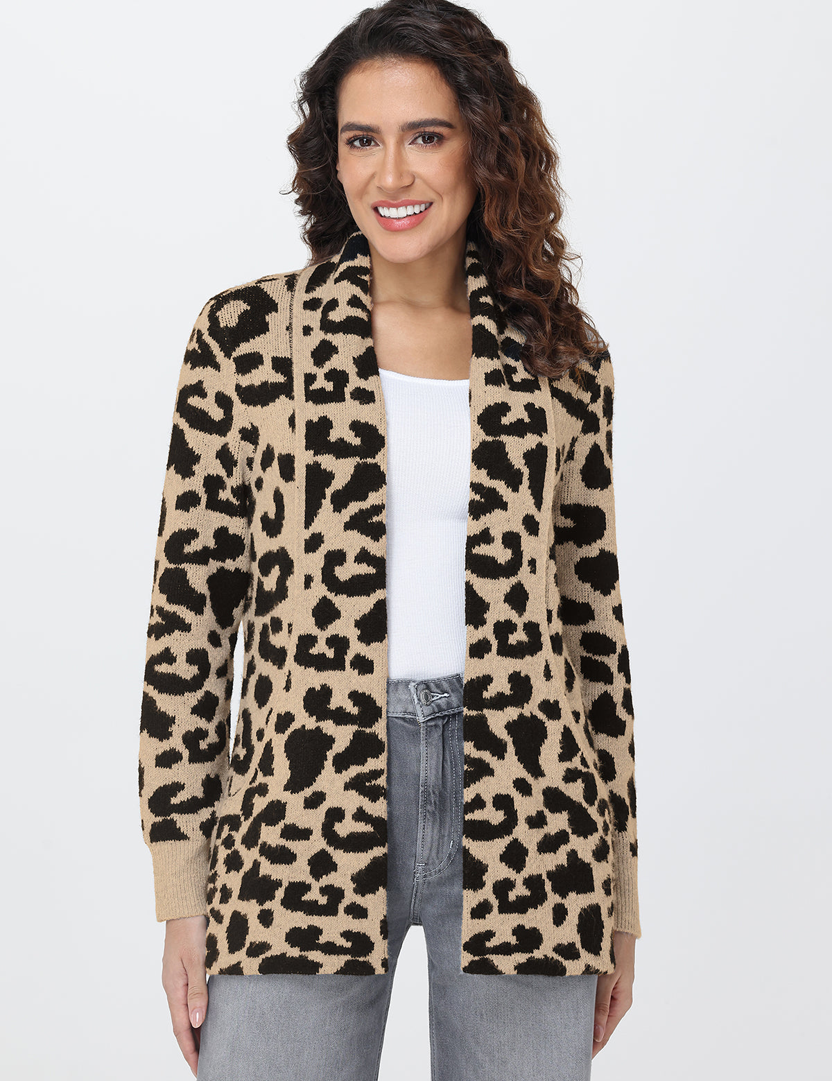 Woman wearing a leopard print cardigan on a white background