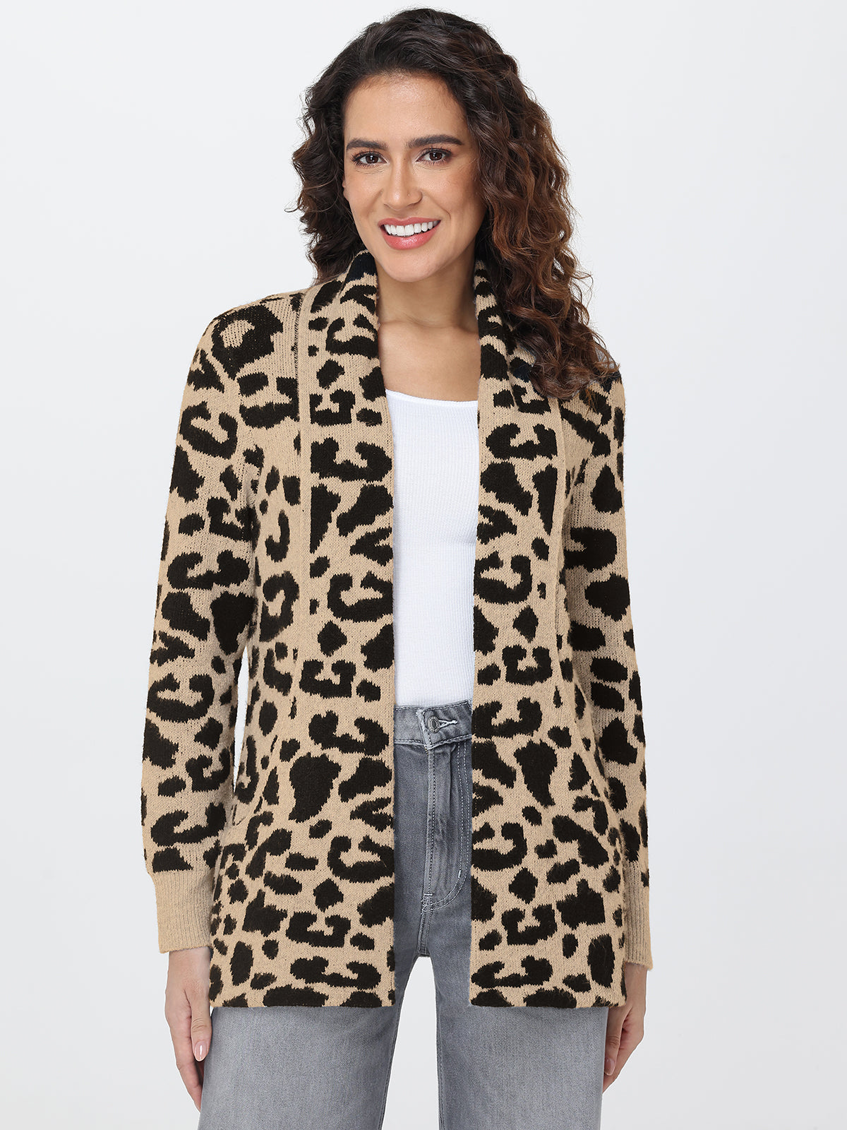 Woman wearing a leopard print cardigan on a white background