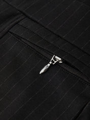 Close-up of a black zipper on a textured fabric background
