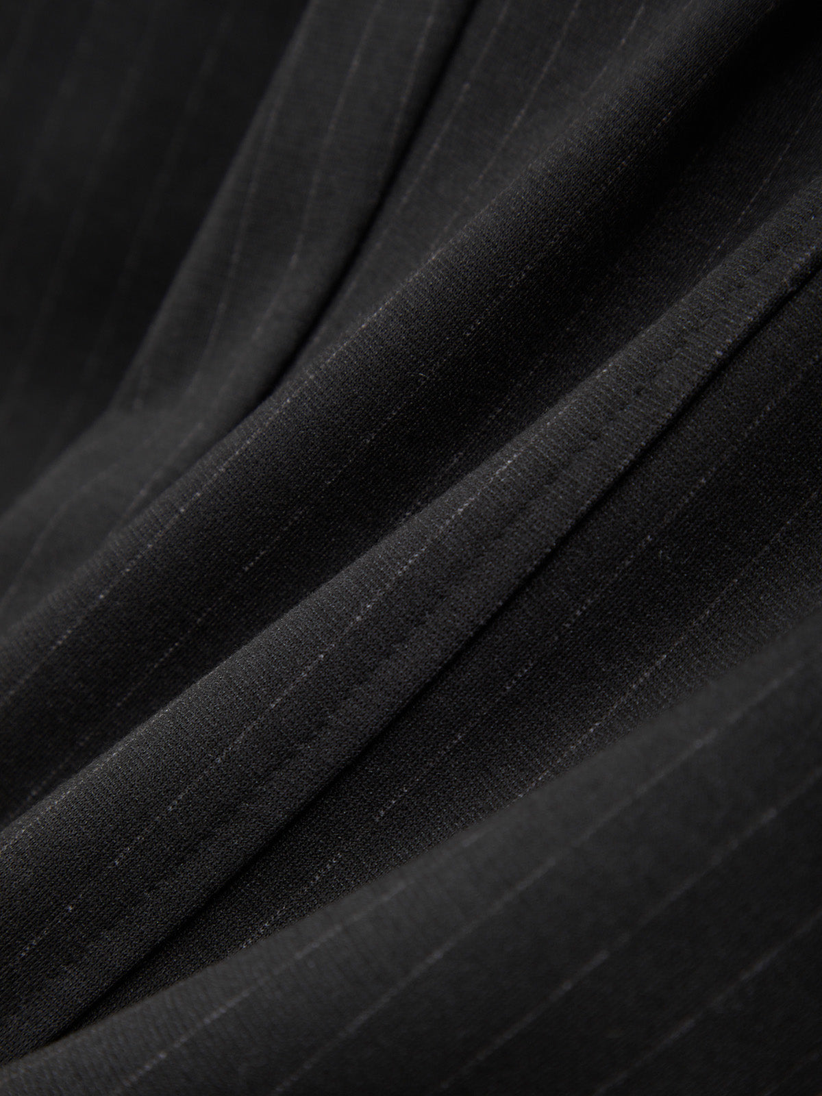 Close-up of black fabric with a textured pattern
