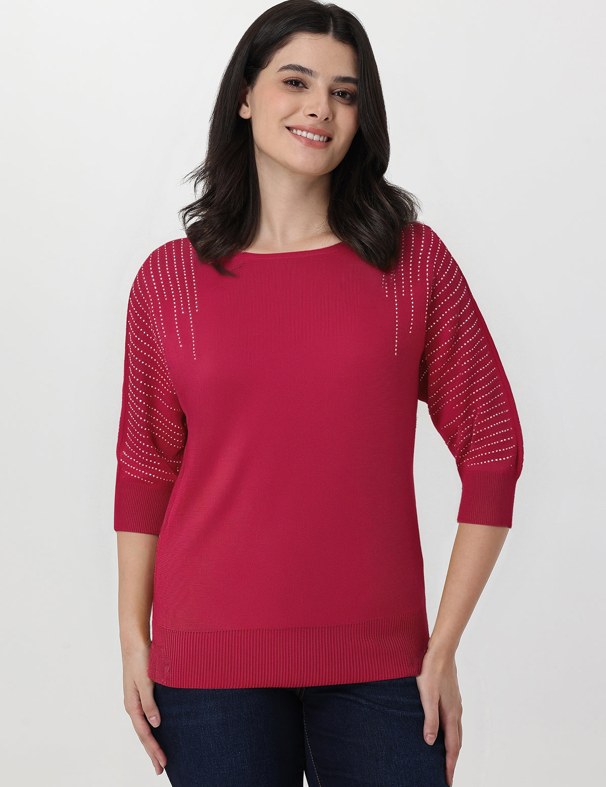 Woman wearing a red sweater with a white background
