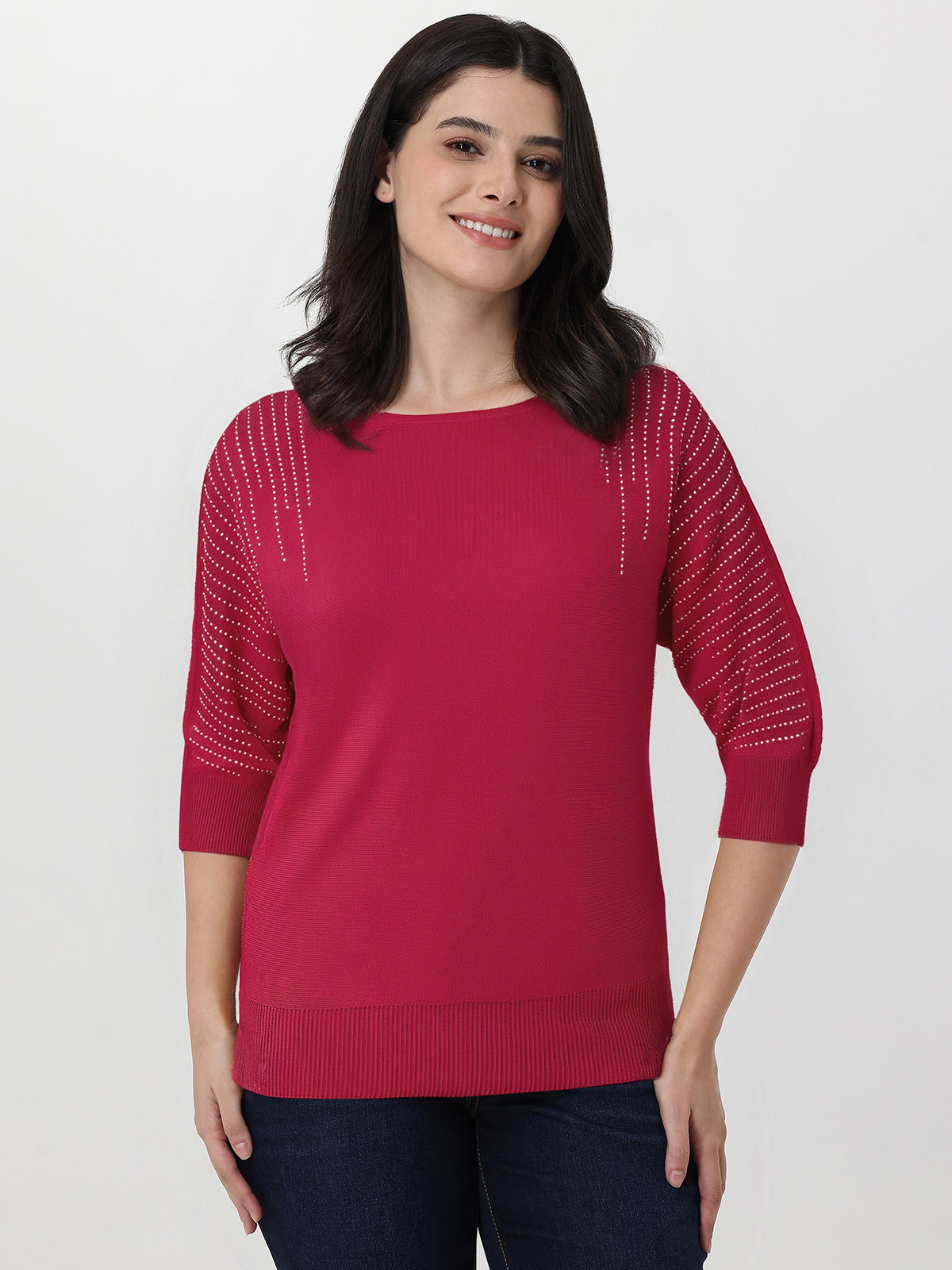 Woman wearing a red sweater with a white background