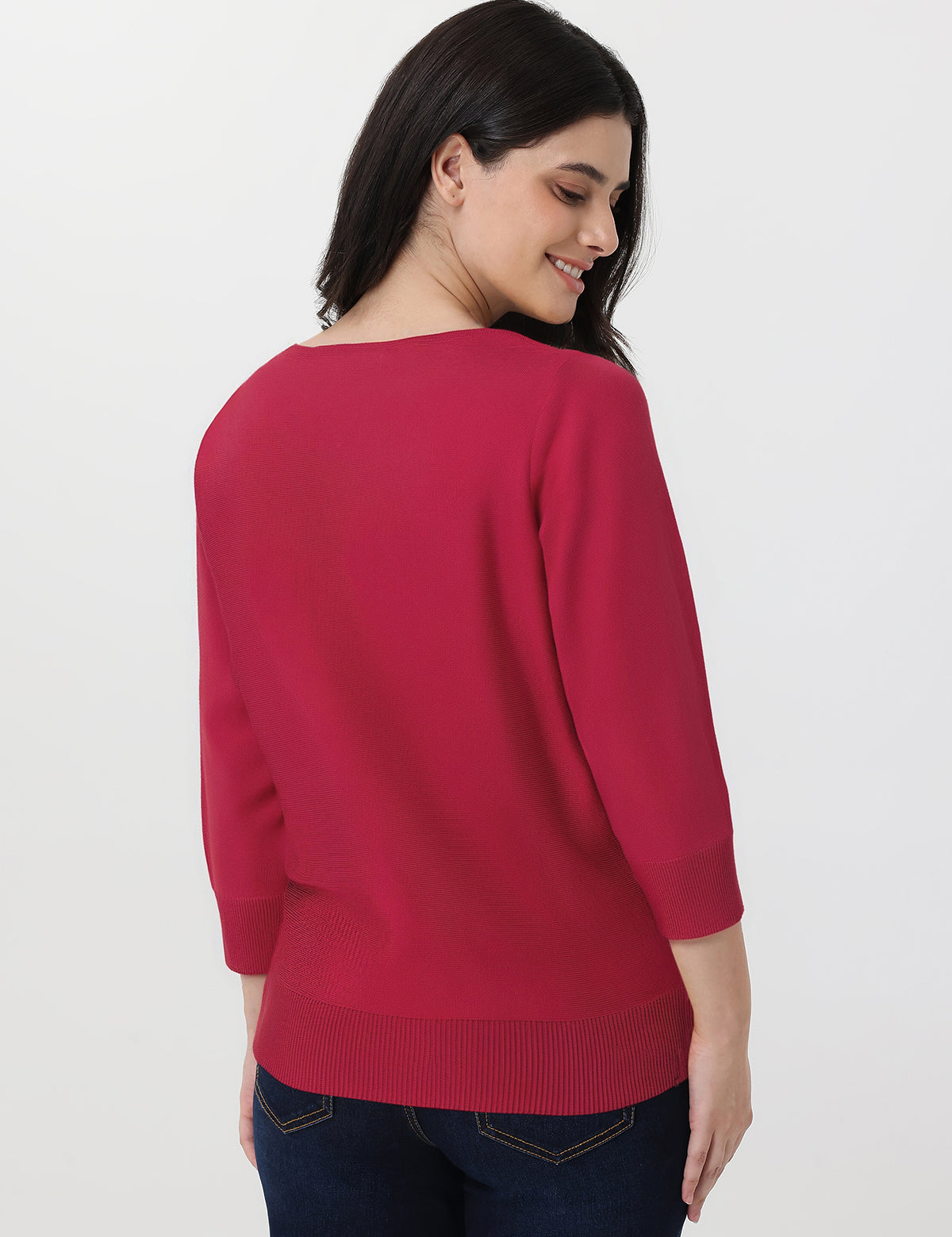 Woman wearing a red sweater on a white background