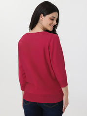 Woman wearing a red sweater on a white background