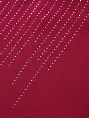 Red fabric with silver bead embellishments