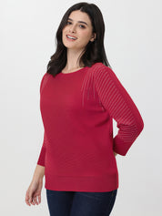 Woman wearing a red sweater with a white background