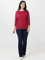 Woman wearing a red top and blue jeans on a white background
