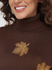 Brown sweater with gold leaf patterns worn by a person