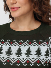 Close-up of a person wearing a sweater with a Christmas tree pattern.