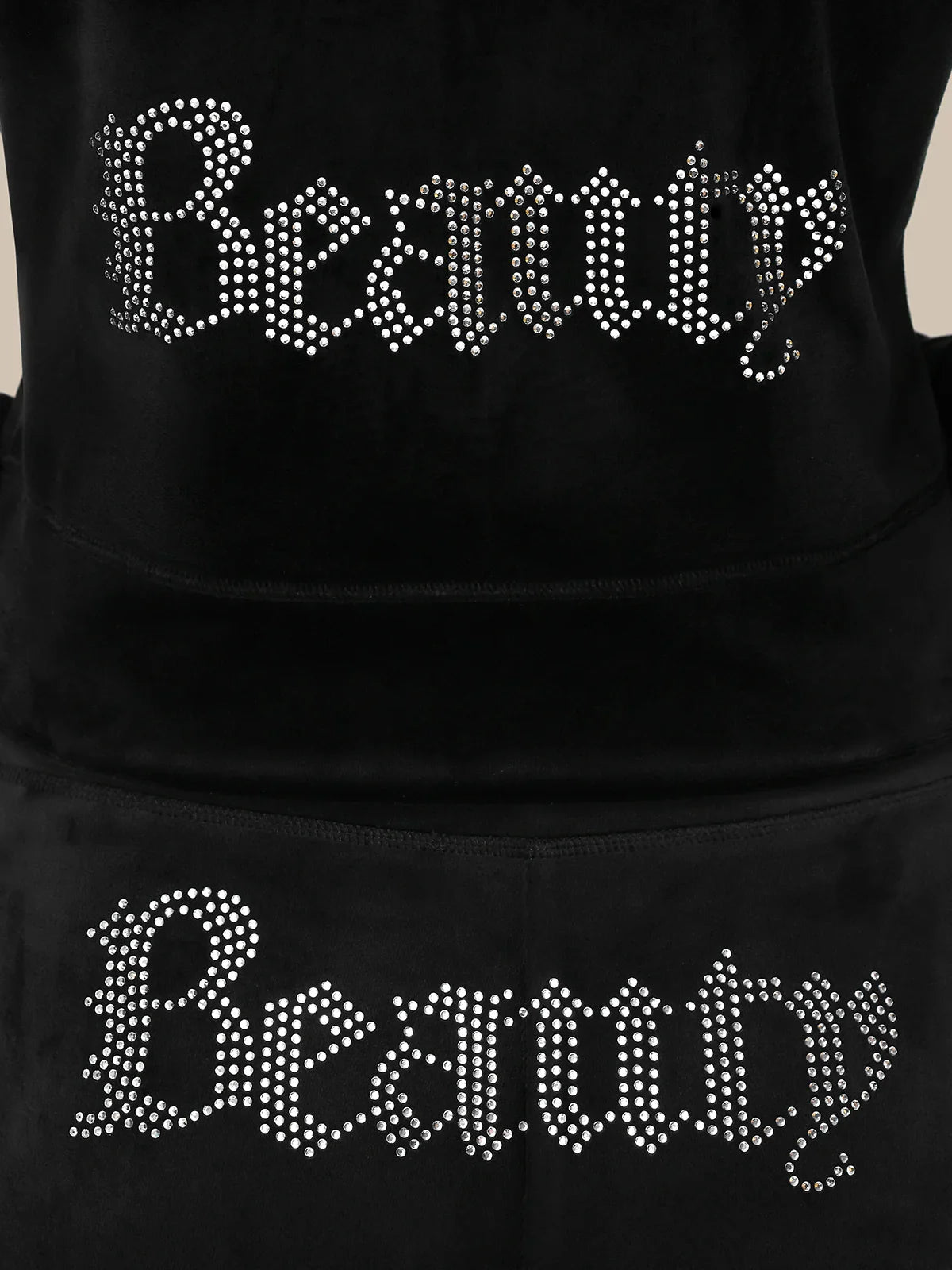 Black hoodie with 'Beauty' text in rhinestone letters on a plain background