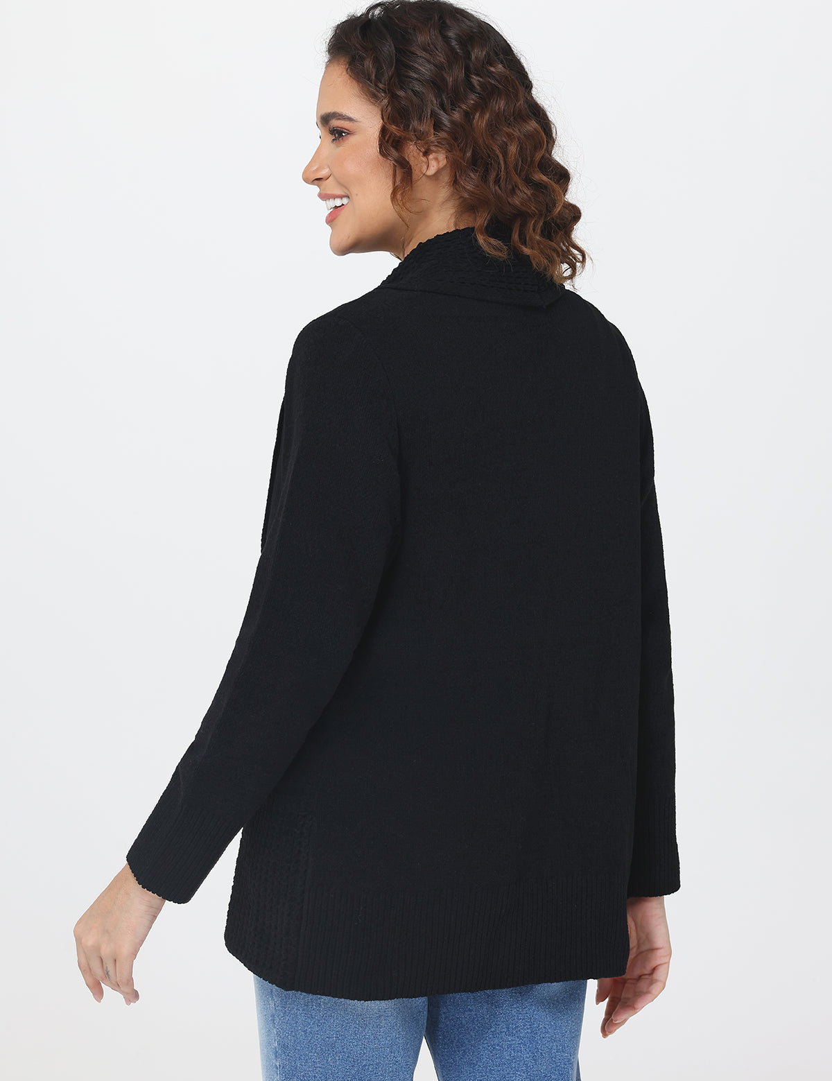 Woman wearing a black cardigan on a white background