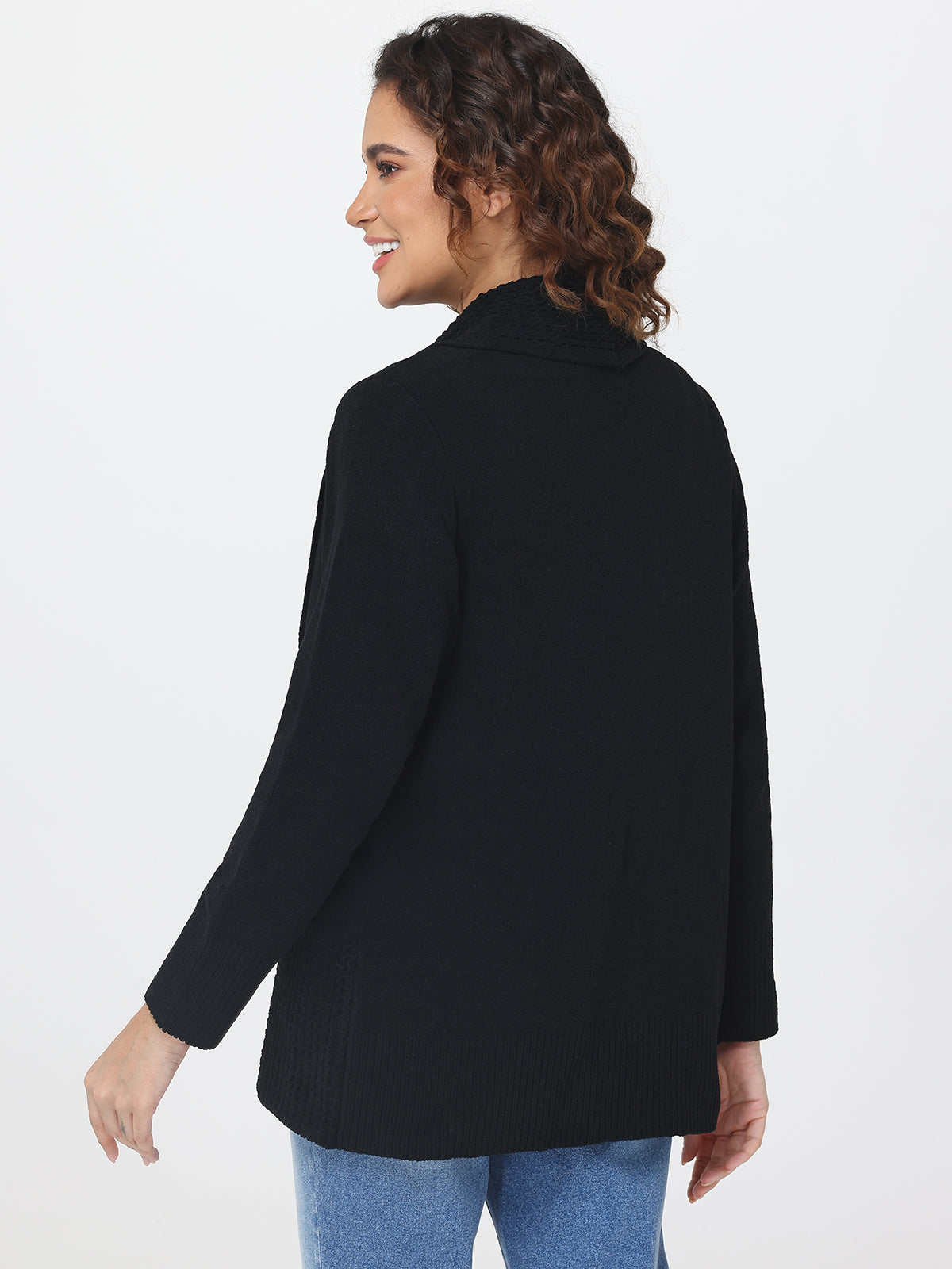 Woman wearing a black cardigan on a white background