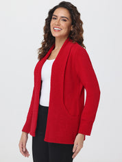 Woman wearing a red cardigan over a white top on a white background
