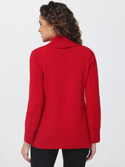 Woman wearing a red sweater on a white background