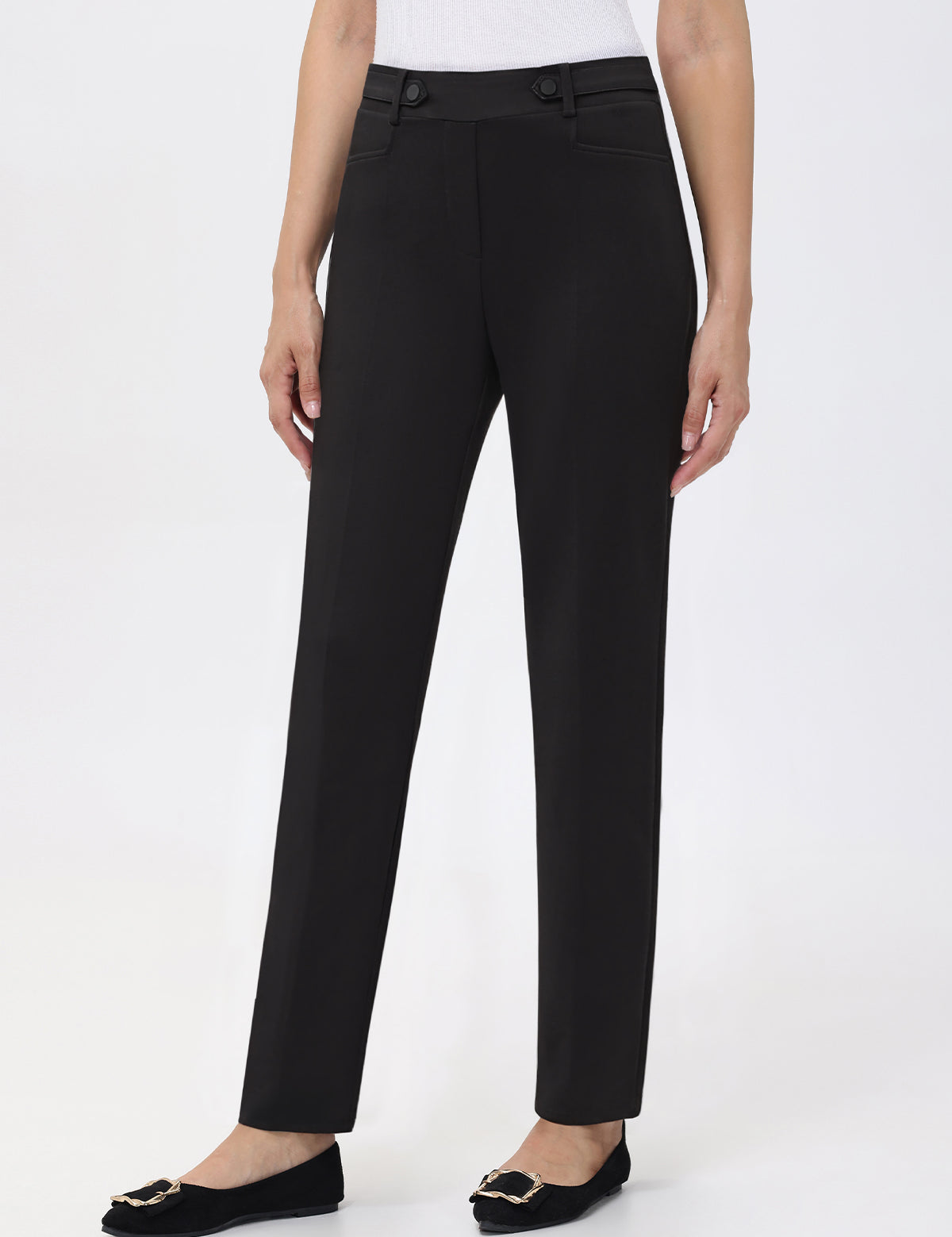 Black pants worn by a person on a white background