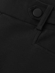 Close-up of a black coat with a button detail