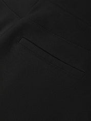 Close-up of a black fabric texture with a pocket detail