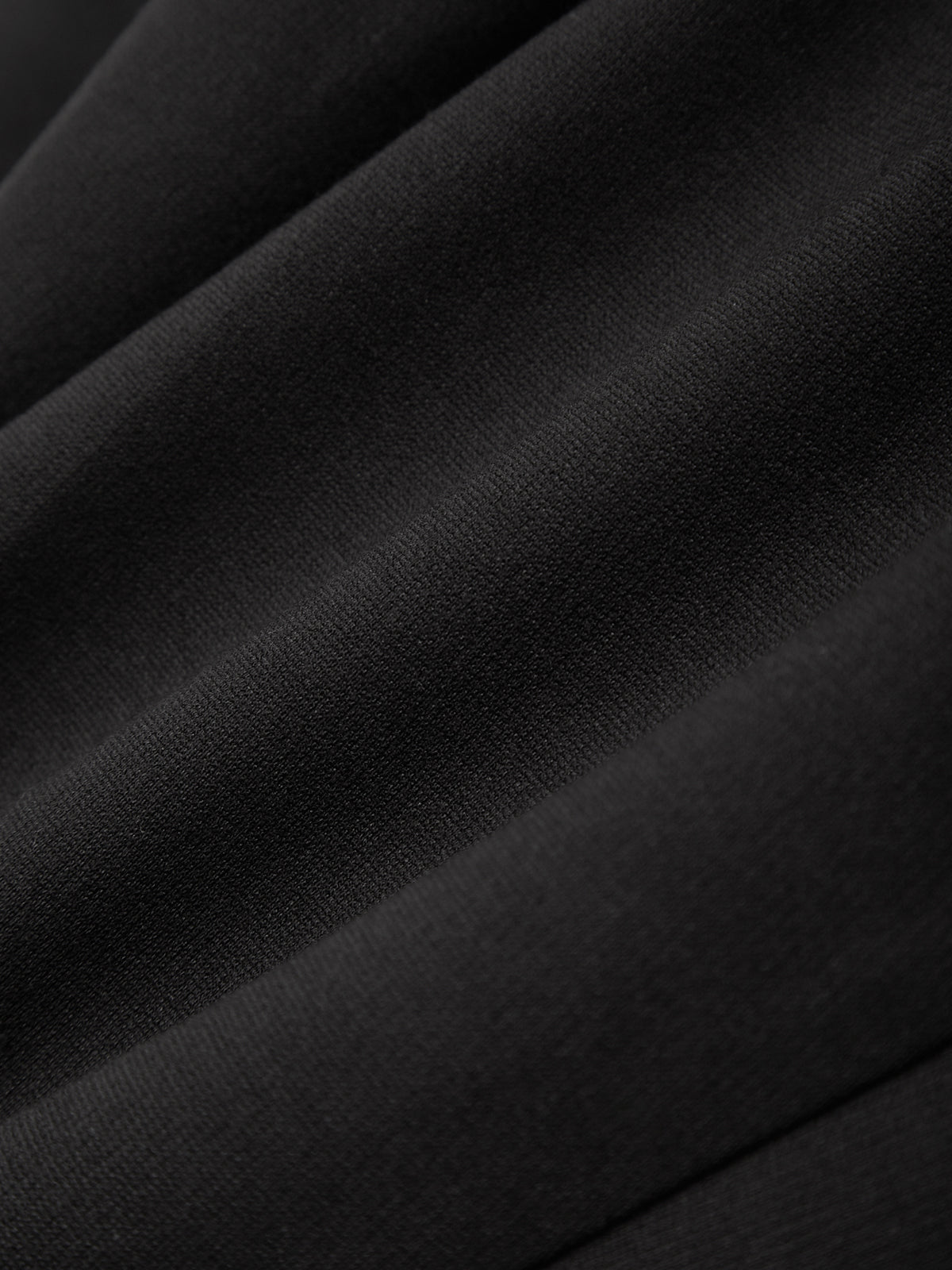 Close-up of black fabric with folds