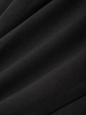 Close-up of black fabric with folds