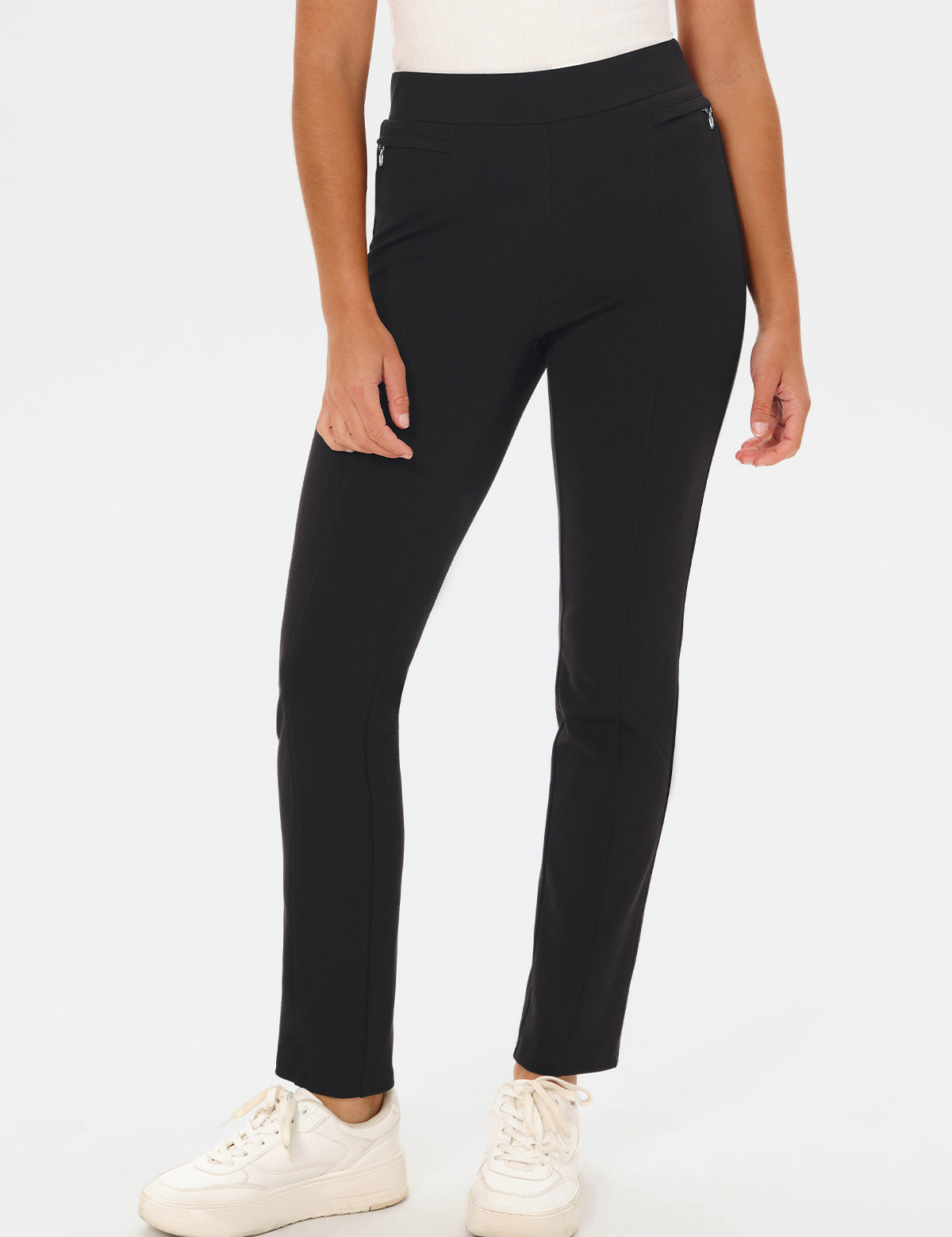 Person wearing black pants on a white background